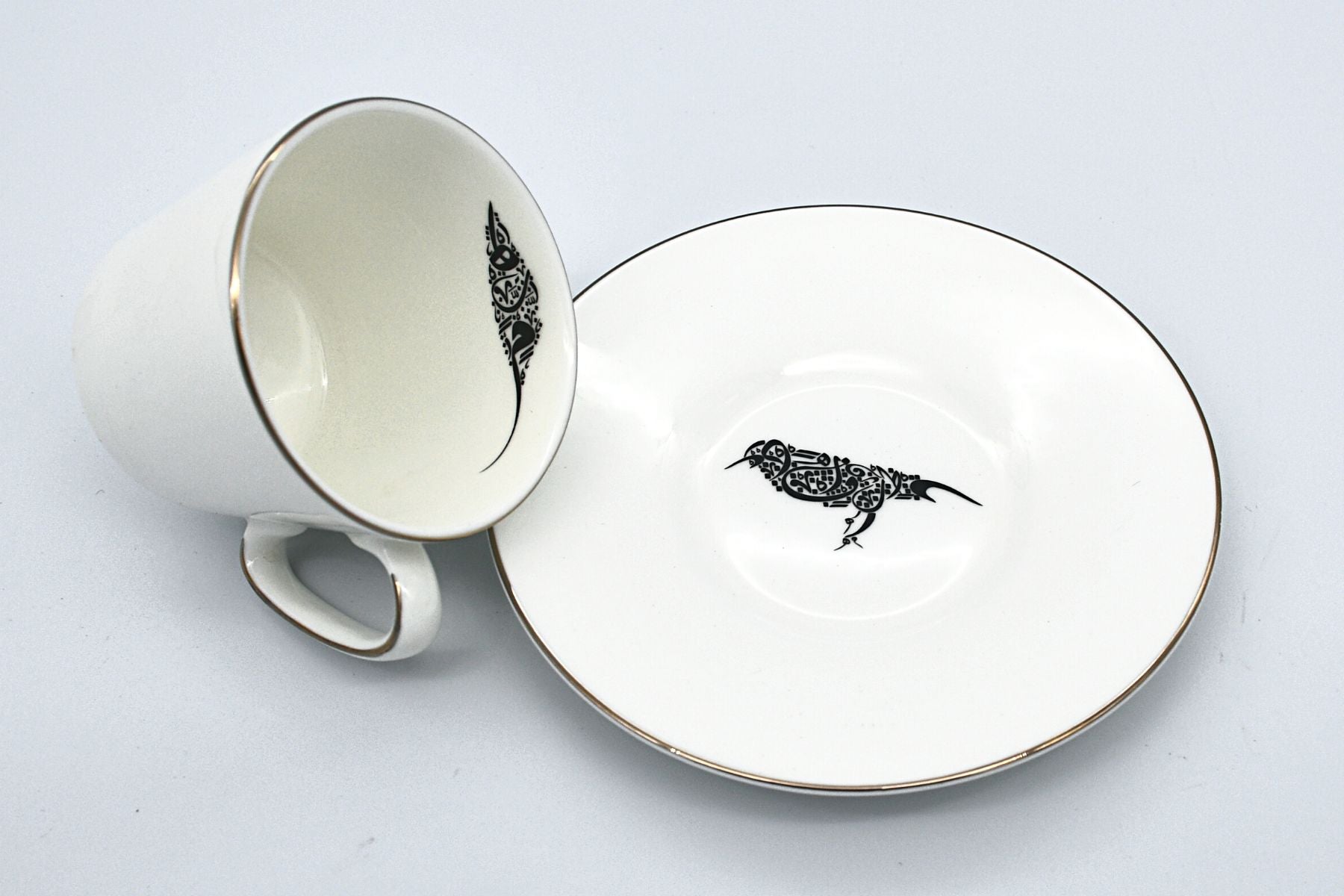 Ceramic Arabic coffee cups with fine bird illustration
