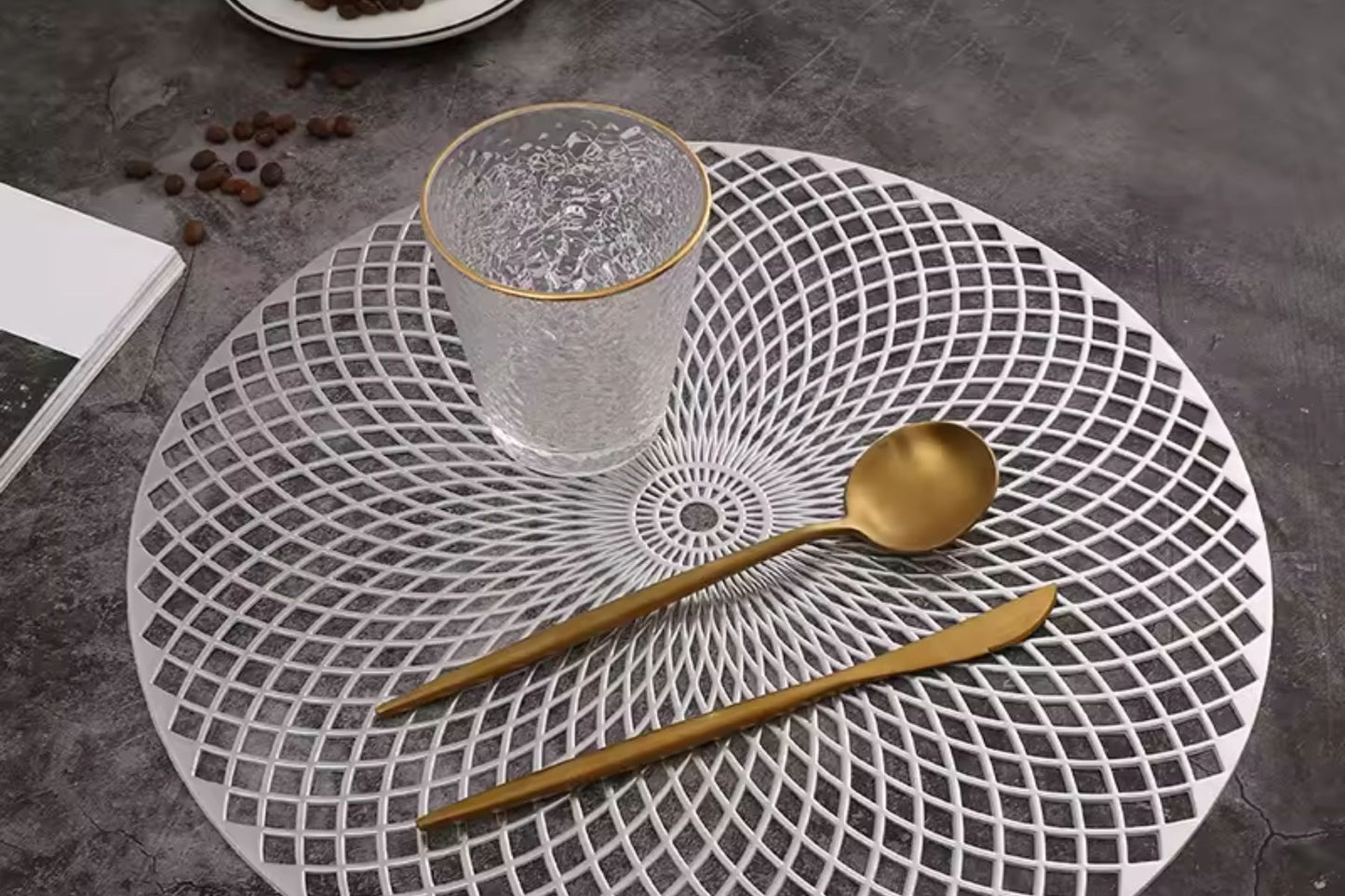 Decorative gold placemat with intricate leaf design