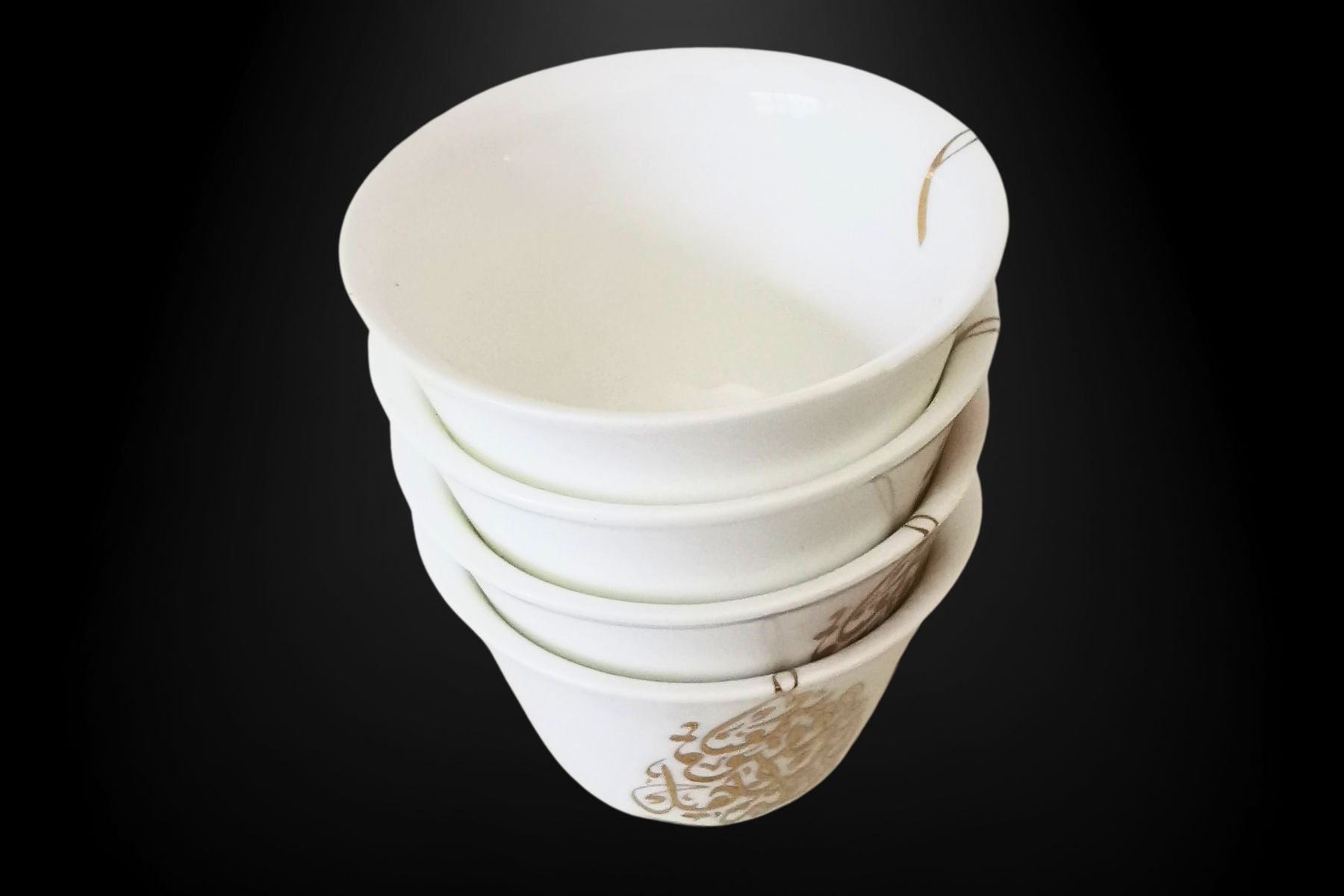 Elegant coffee cups with Arabic calligraphy close-up