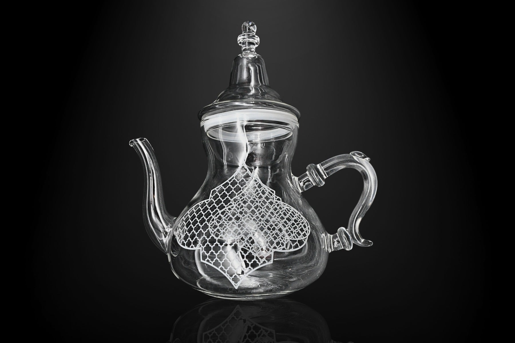 Front view of geometric pattern teapot in gold and black