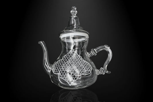 Front view of geometric pattern teapot in gold and black