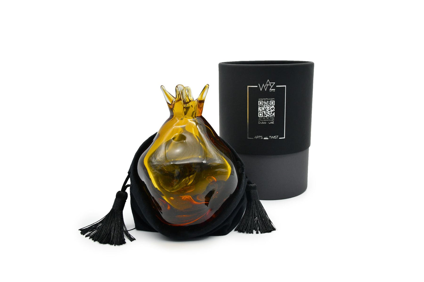 Handcrafted amber pomegranate figurine on display