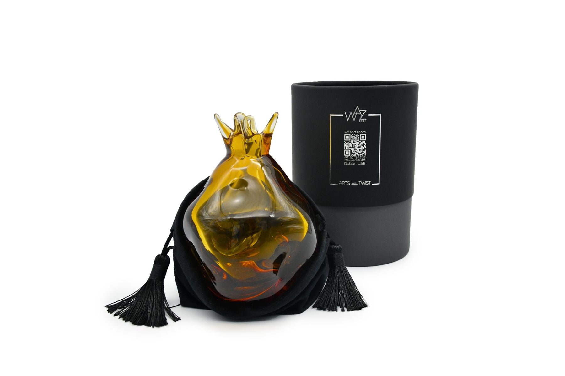 Handcrafted amber pomegranate figurine on display