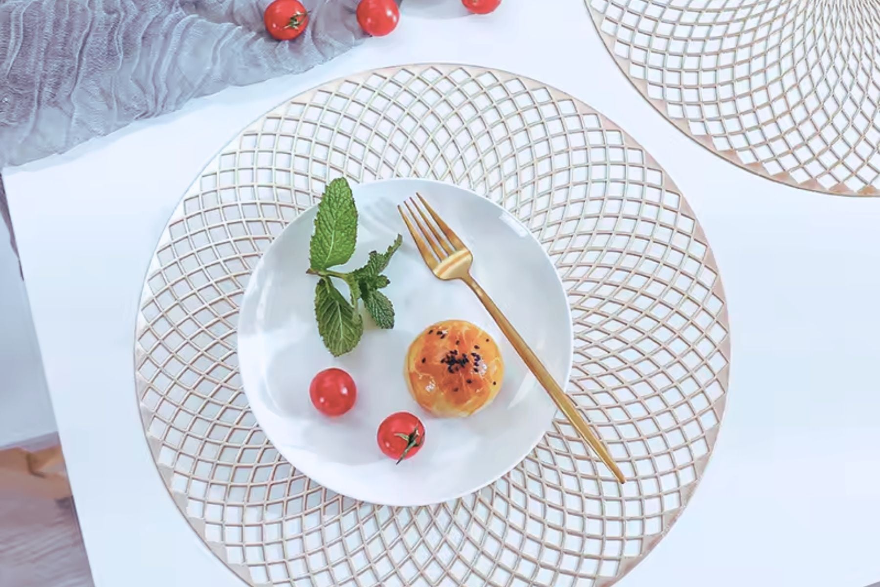Close-up of metallic gold leaf table mat design