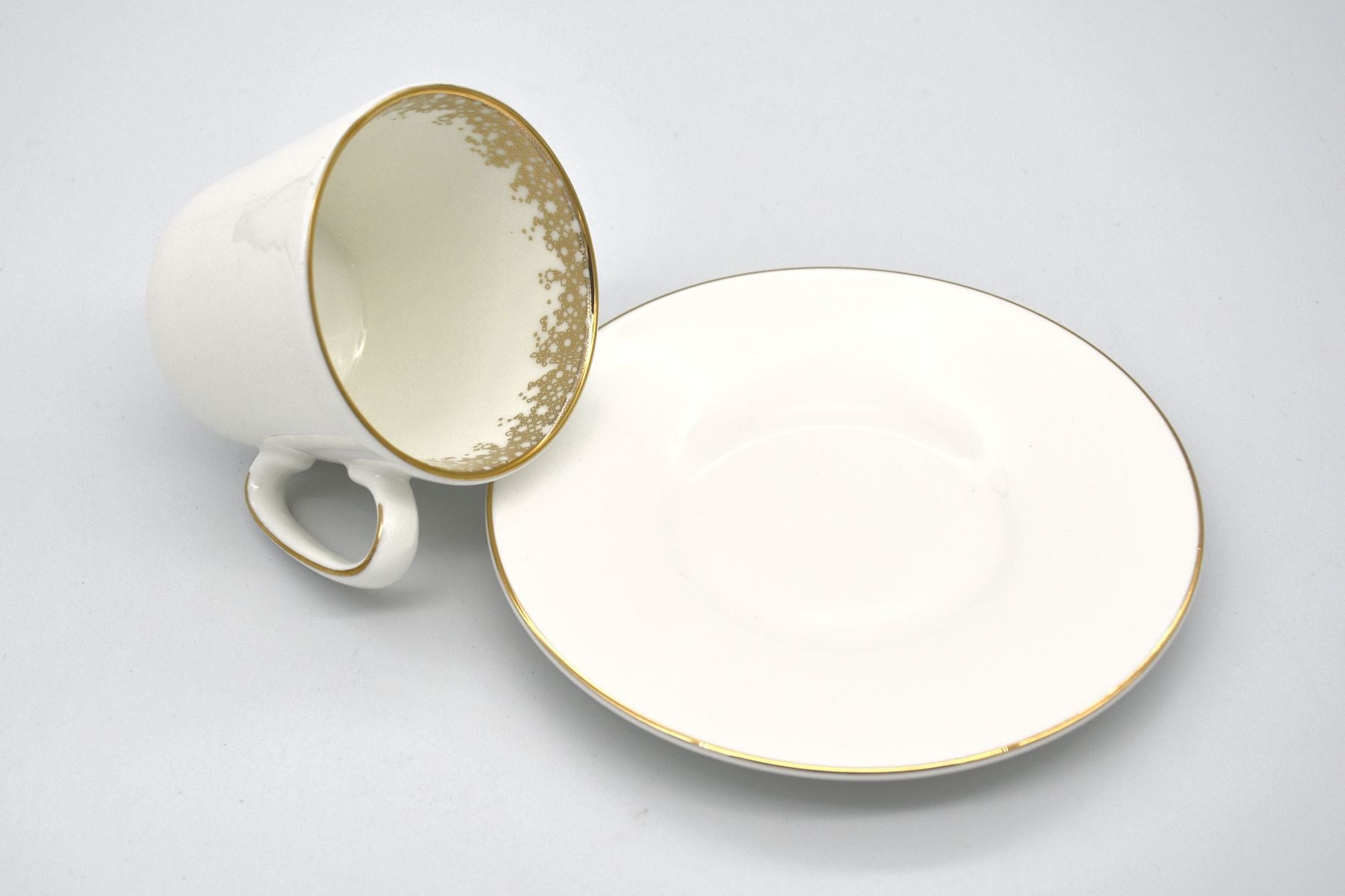 Modern ceramic coffee cups featuring artistic geometric motifs