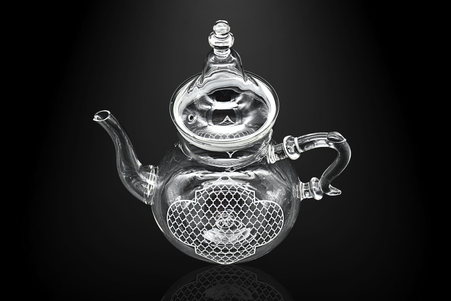 Glossy porcelain teapot with gold handle and geometric design