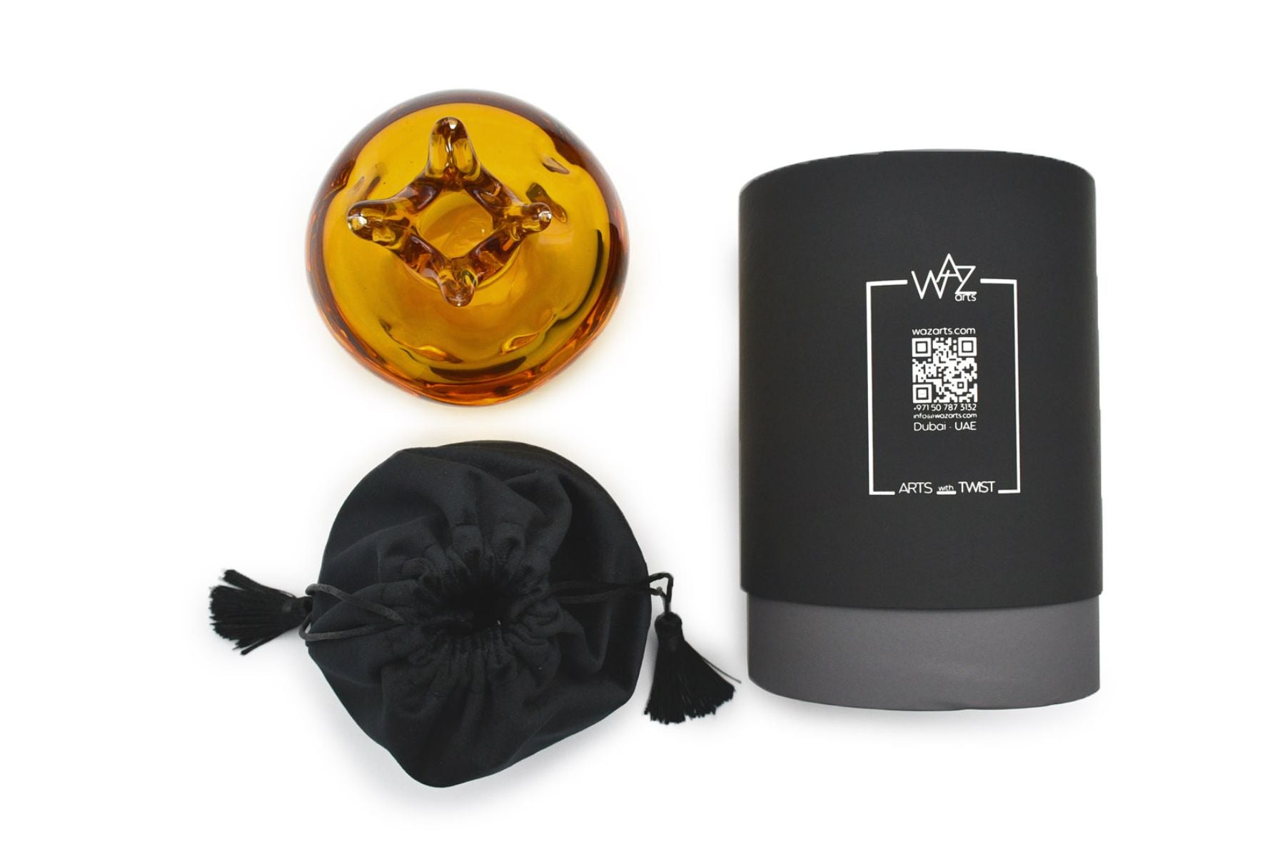 Symbolic amber pomegranate decor on modern shelf