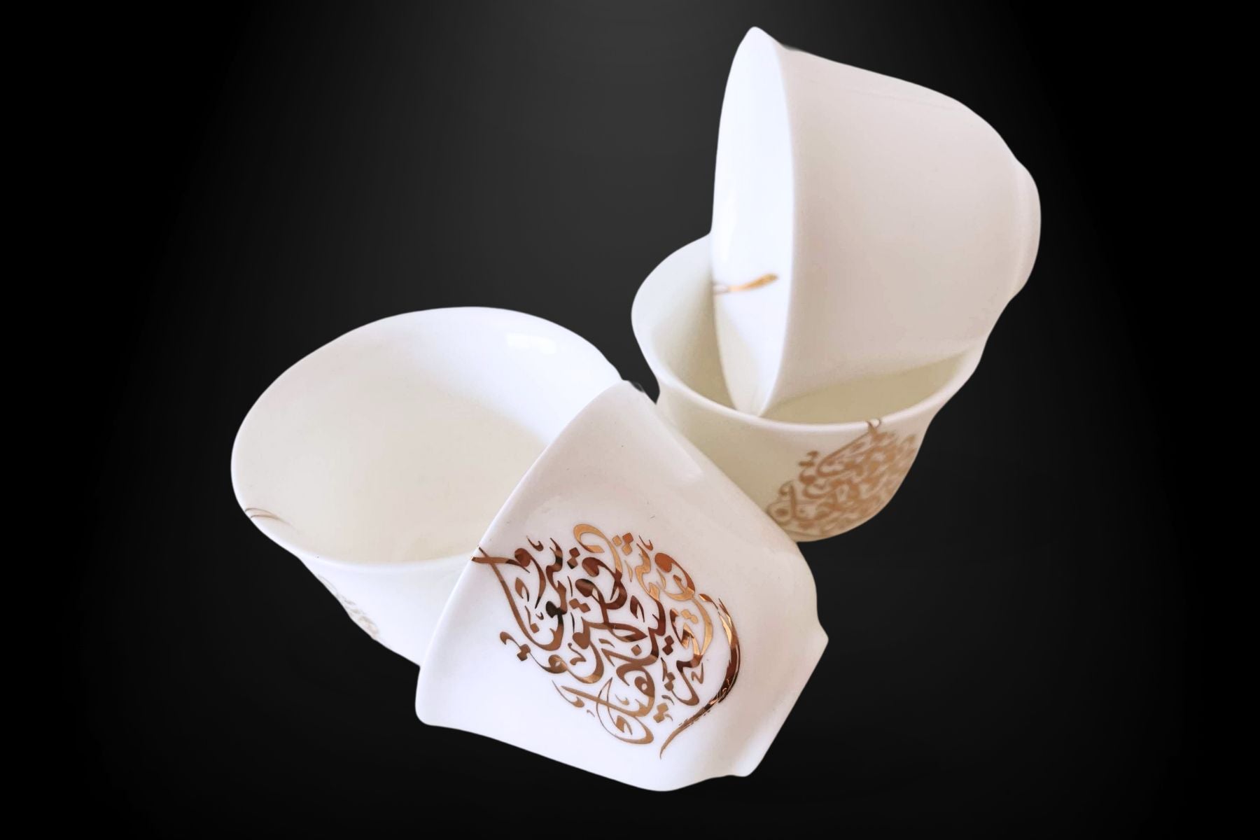 Traditional Gahwa coffee cups with Arabic script