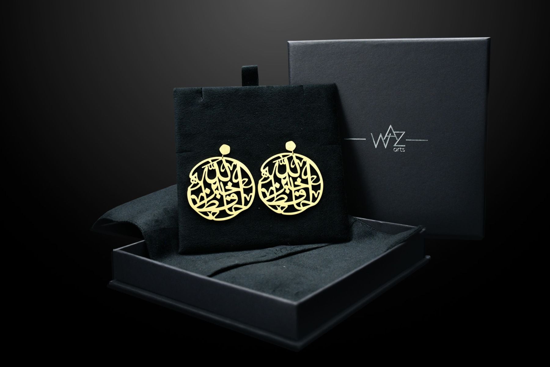 Close-up of Arabic Calligraphy Earrings with "Allah Khair Hafiz" design