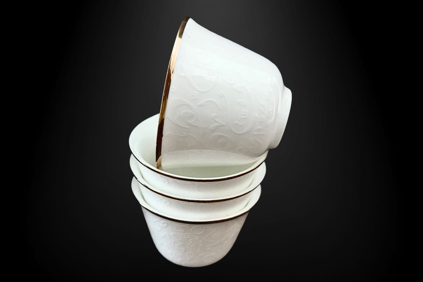 Close-up of Arabic script on decorative coffee cups